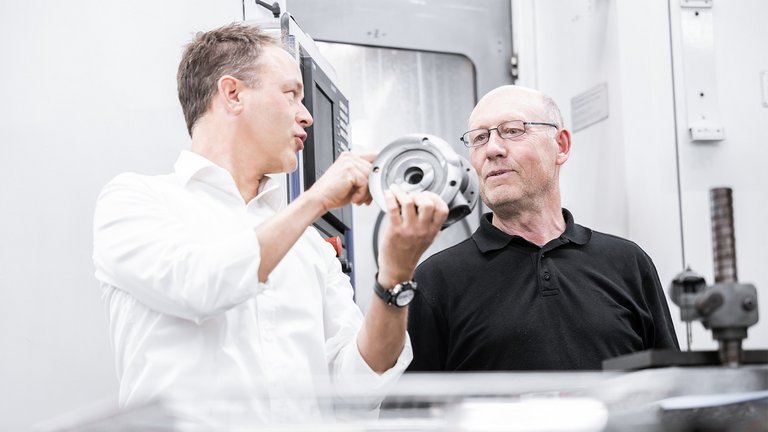 Two gear pump experts from Scherzinger Pumps. 